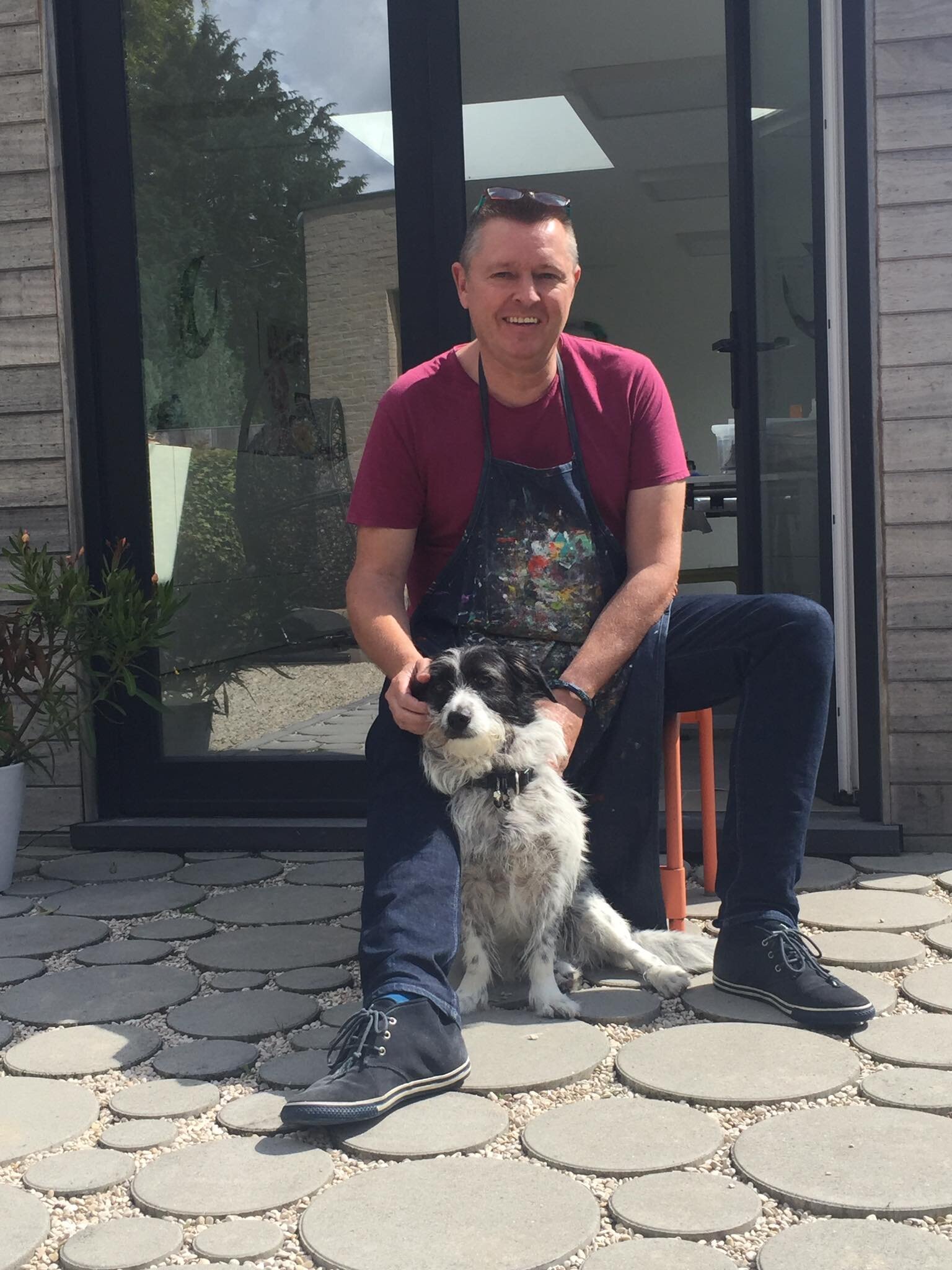 Together with my dog at the door of my studio